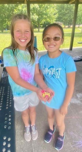 Working as a team to pick up the most water balloons!