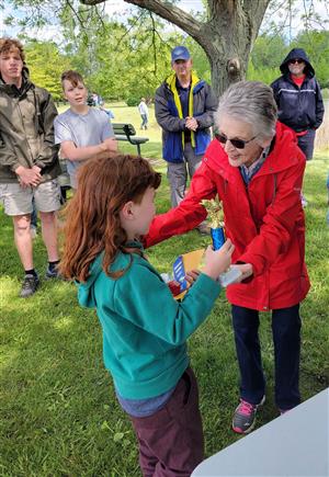 Mrs. Horton presenting the trophy to one of our young fishers.