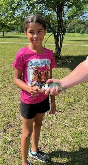 Our most successful angler of the day posing with her catch! 